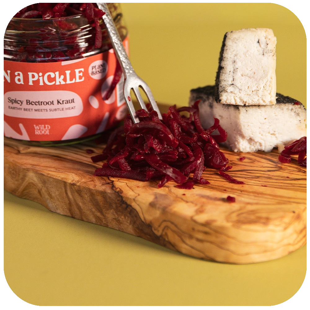 Truffle & Charcoal Cheese and Spicy Beetroot Kraut close up on a fork 